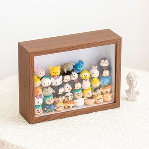 Detailed view of walnut wooden display shadow box filled with colorful mini figures