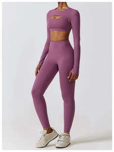Detailed view of mauve yoga three-piece set featuring cutout long sleeve shrug and leggings