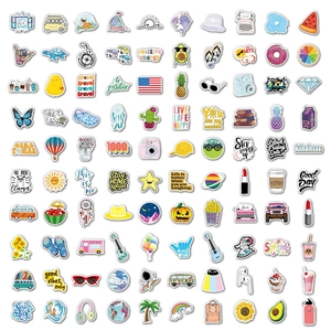 Detailed flat lay of 100 colorful waterproof PVC VSCO stickers for luggage and guitars
