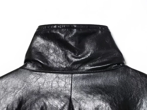Close-up of the standing collar and smooth black leather texture on this bomber jacket