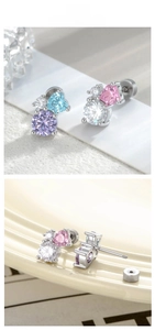 Detailed view of heart-shaped zircon ear studs with secure screw back design