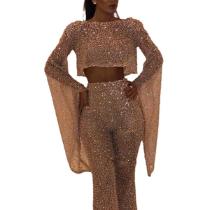 Sparkly rose gold sequin two-piece set with long flare sleeve top and high-waist pants