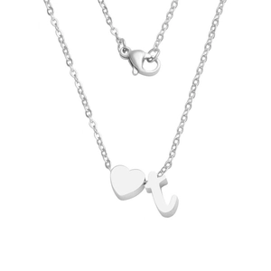Detail of silver heart pendant and lowercase letter t on stainless steel chain necklace