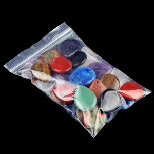 Mix of teardrop-shaped natural crystal and agate stone pendants in various colors