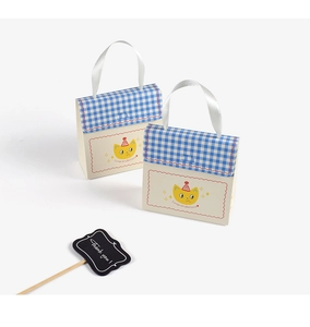 Detail of blue plaid gift box with cartoon cat illustration and white satin handle