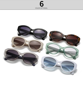 Close-up of six color options for oval sunglasses with diamond-studded frames