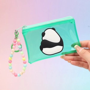 Close-up of clear green PVC panda coin purse with pastel beaded chain accessory