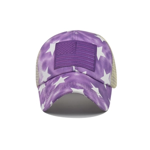 Detail view of purple tie-dye baseball cap with star pattern and mesh ponytail design
