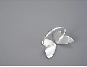 Macro view of adjustable S925 silver ring featuring elegant butterfly wing details