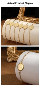 Detail of S925 sterling silver beaded bracelet with engraved alphabet coins and S925 stamp