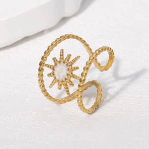Gold-plated stainless steel adjustable starburst ring with white enamel centerpiece