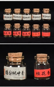 Macro shot of traditional handmade scent pearls in glass vials with cork stoppers