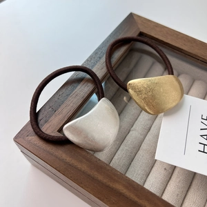 Minimalist matte gold and silver metal hair ties with premium elastic brown rope bands