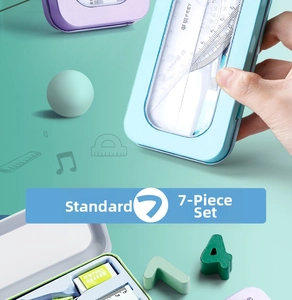 Close-up of a 7-piece geometry drawing set in a light blue tin storage box