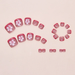 Detail view of 24pcs pink French press-on toe nails with white floral patterns