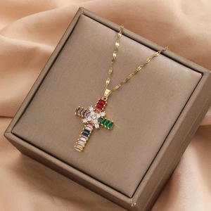 Gold cross necklace with colorful rectangle gemstones and white cubic zirconia on silk
