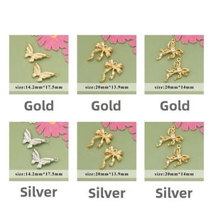 Detailed views of 18k gold plated bow and butterfly jewelry pendants with zircon stones