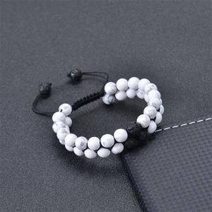Detailed macro of double-layer braided bracelet with white turquoise and volcanic stone