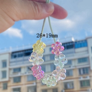 Macro shot of 26x19mm aurora colorful flower beads for DIY hair accessories and phone cases