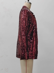 Detailed side view of wine red sequin blazer jacket on a mannequin with reflective texture
