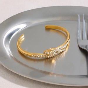 Luxurious 18k gold-plated stainless steel snake cuff bracelet with shimmering crystals