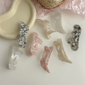 Variety of acetic acid wing lily hair clips in plaid and pearl white patterns