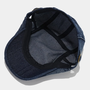 Retro washed denim flat cap in dark blue with golden buckle and sweatband interior