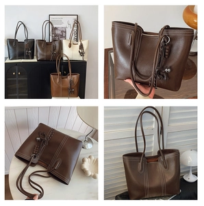 Macro shot of stylish tote bags showing contrast stitching and cute cat charm detail
