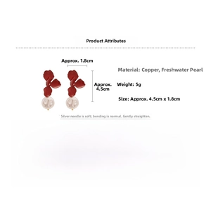 Detail shot of vintage red flower earrings with freshwater pearl drops and silver pins