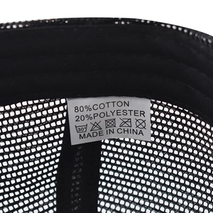 Detail view of cotton mesh baseball cap interior with material label and stitching