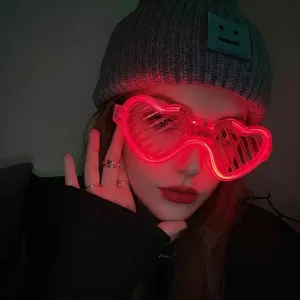 Detail of red LED heart-shaped glasses with shutter slats for festive party parties