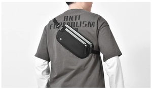 Detail view of the waterproof RFID waist bag worn by a model to show size and fit