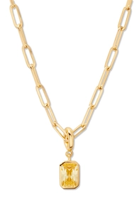 Detail of 18K gold-plated paperclip chain necklace with a rectangular yellow gemstone pendant