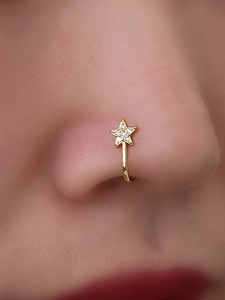 Elegant gold star nose ring with sparkling crystals on a model for a stylish look