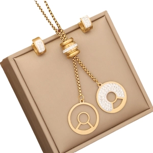 Star-set gold jewelry set featuring a ring pendant necklace and matching hoop earrings