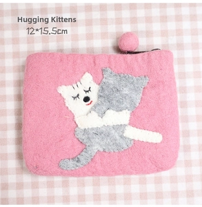 Pink wool felt coin purse with cute cat embroidery detail and fuzzy pompom zipper