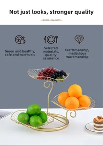 Detailed view of a three-tier golden metal fruit basket with elegant hollow line design