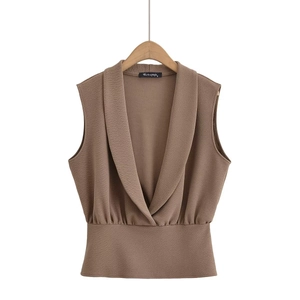 Brown sleeveless V-neck crossover top with ruched waist and textured crepe fabric