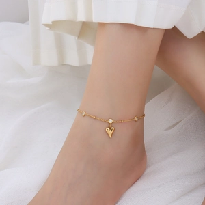 Elegant 18k gold plated heart anklet with zircon charms worn on female ankle