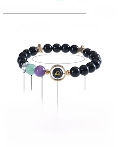 Detail of Libra natural stone bracelet with 8mm obsidian, blue sandstone, and crystals