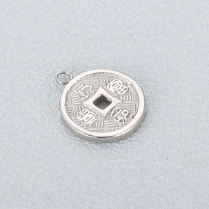 Detail of silver stainless steel coin pendant with traditional Chinese characters