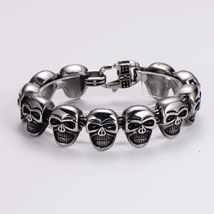 Macro shot of punk style skull bracelet with vintage silver finish and fold-over clasp