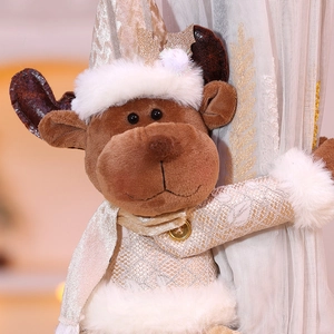 Detail view of a plush reindeer curtain tieback with gold sequins for Christmas decor