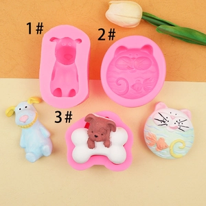 Detailed view of pink silicone molds with 3D cartoon dog and cat designs for DIY soap