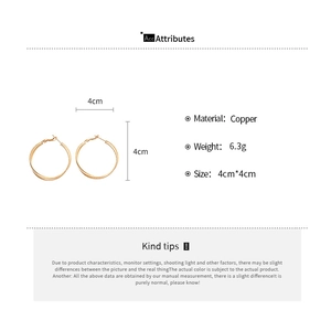 Macro view of 18k gold plated twisted double hoop earrings showing 4cm diameter dimensions