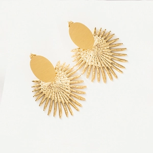Macro detail of gold fan-shaped stud earrings with brushed metal and hammered textures