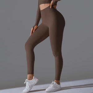 Detail of high-waist seamless coffee yoga set featuring thumbholes and peach lift leggings