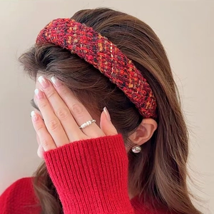 Red plaid tweed wide headband with gold accents worn by a model for a vintage look