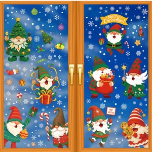 Detailed view of Christmas gnome window stickers with snowflakes on a glass pane