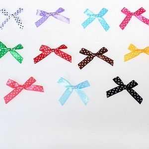 Handmade polka dot ribbon bows in various colors for wedding gift box decoration